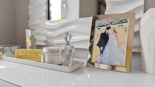 An image of a dressing table featuring a framed wedding photo from and example of a typical Latimer home.